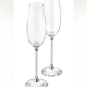 Like new. Never used. Beautiful Swarovski crystalline champagne flute set.